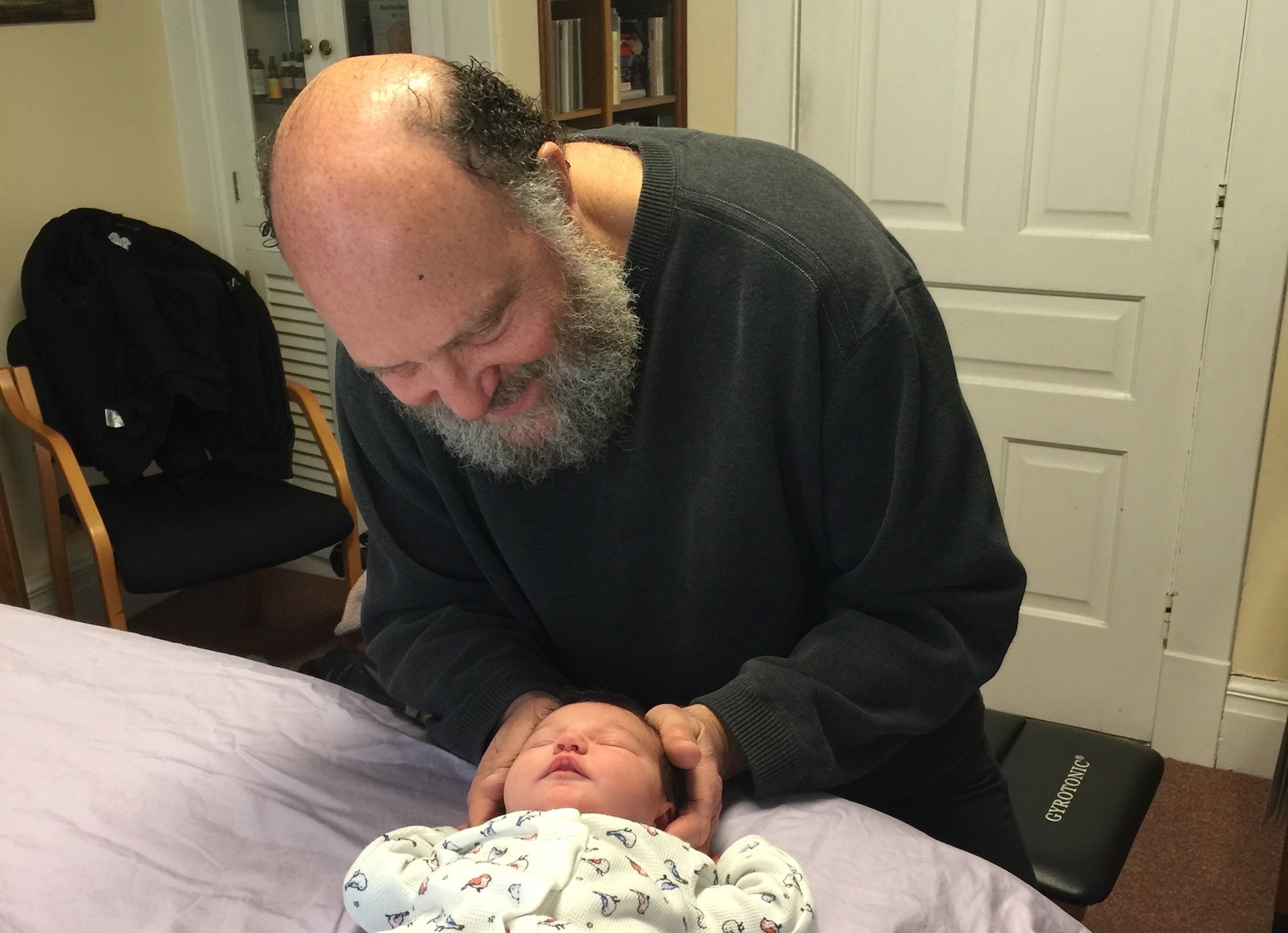 Doctor Jay Sandweiss Treating A Baby